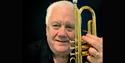 Bruce Adams - holding a trumpet