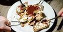 Four people eating a dessert