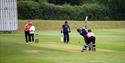 Cricket match being played