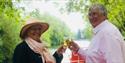 Woman and man toasting with white wine