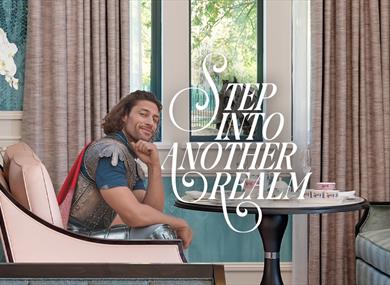 Step into another realm | person in battle dress sitting in Fairmont Windsor Park lounge, helmet on chair and horse visible through the window
