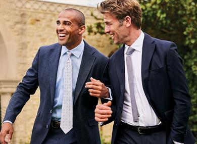 Two people wearing suits