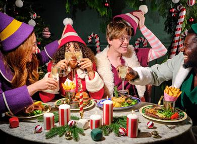 People enjoying Christmas food at Bill's