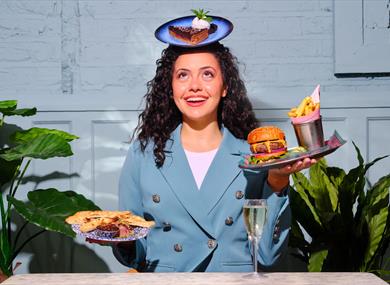 Woman balancing food and drink