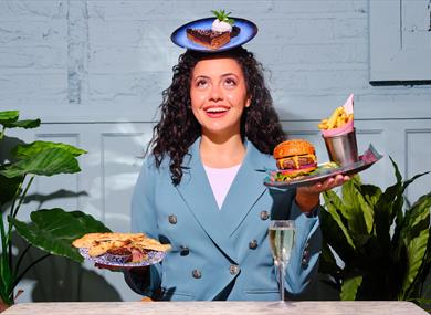Woman balancing plates of food