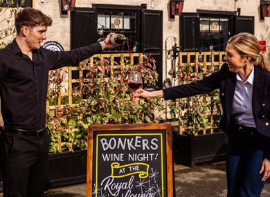 Red wine being poured into a glass