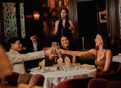 People dining with singer behind