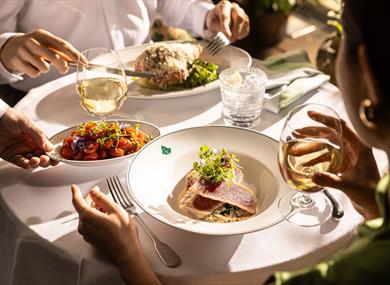 People enjoying The Ivy Edition menu
