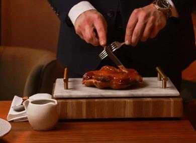 Food being carved at the table