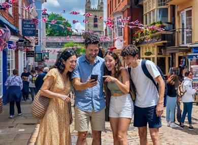 People in Windsor looking at their phones