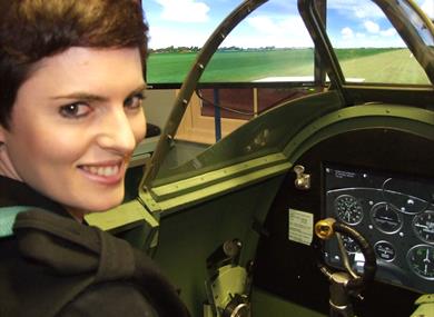 Woman in Spitfire Simulator at Maidenhead Heritage Centre