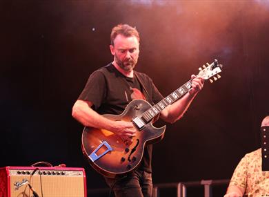 Hugh Turner playing guitar