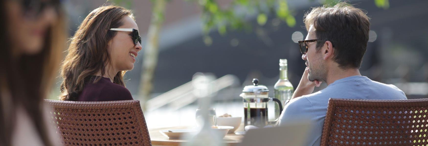 Two people enjoying al fresco breakfast at the Runnymede on Thames hotel