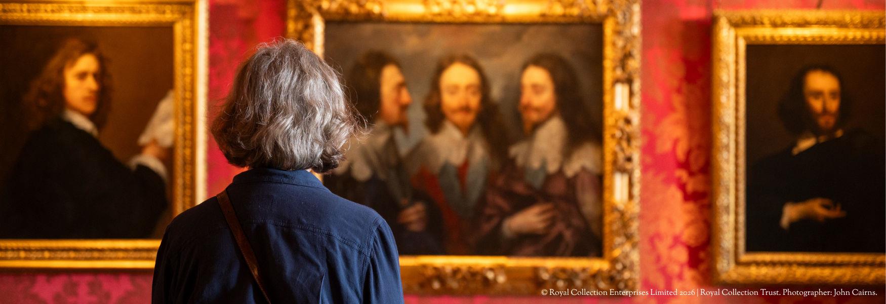 Person looking at paintings at Windsor Castle. © Royal Collection Enterprises Ltd 2026 | Royal Collection Trust. Photographer: John Cairns