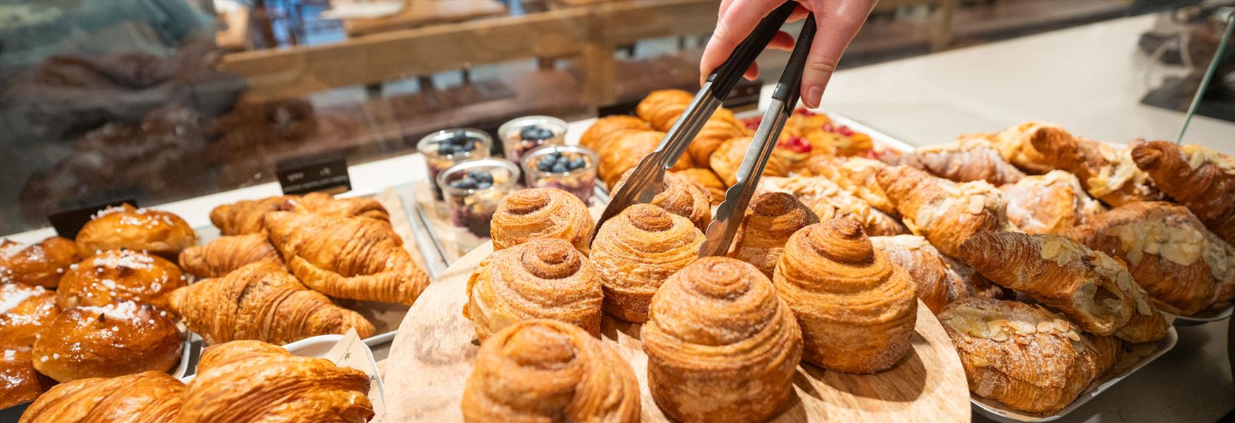 Windsor Farm Shop Cafe, person choosing pastries