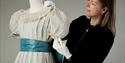 Caroline de Guitaut, curator of the display, condition checks the costumes in preparation for display. Royal Collection Trust / © Her Majesty Queen El