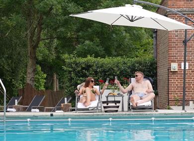 People by the poolside at Great Fosters