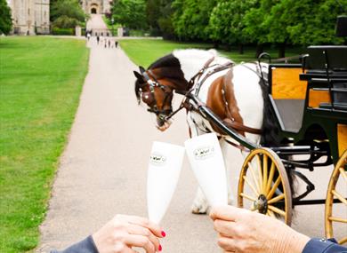 Windsor Carriages celebration package with flutes and champagne and Windsor Castle in the distance