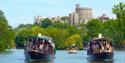 French Brothers boats on the River Thames with Windsor Castle in distance