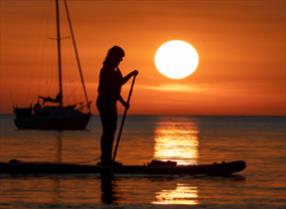 An image of a paddleboarder in Runswick Bay
