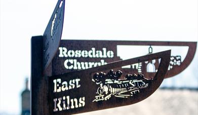An image of an iron signpost. Photograph by Davy Major.