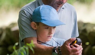 An image of two people Geocaching. Photograph by Mike Nicholas / NYMNPA