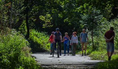 An image of walkers on The Cinder Track