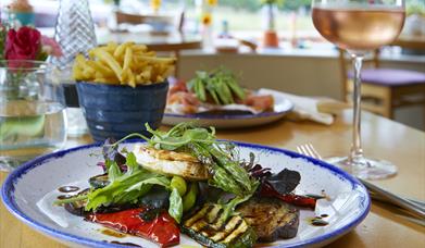 An image of The Yew Tree Cafe and Bistro - plate of food and glass of wine