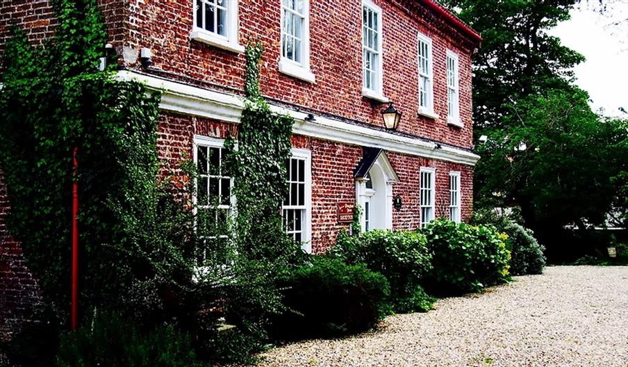 An exterior image of Wrangham House Hotel