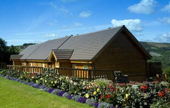 An image of Raven Hall Lodges exterior and garden