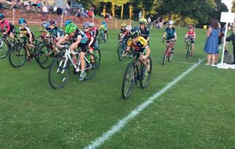 An image of cyclists setting off on a grass race at Scarborough Cycling Festival