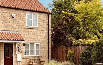 An exterior of Tykes Cottage