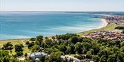 An image of Sewerby Hall and Gardens from above with sea in the distance.