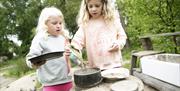 An image of two children playing at Sutton Bank National Park Centre