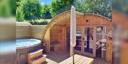 An image of a pod with jacuzzi at St Helens Touring Caravan and Camping