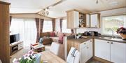 An image of the kitchen and living area inside a caravan at Robin Hood Caravan Park (Tourers/Tents)