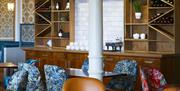 An image of bar with seating area