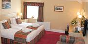 An image of a double bedroom at Saxonville Hotel