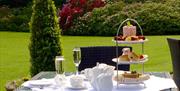 An image of afternoon tea in the gardens at Wrea Head Hall Hotel, Scarborough