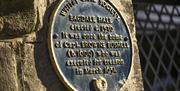 An image of a blue plaque at Bagdale Hall, Whitby