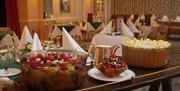 An image of the dining area set up for a wedding at Saxonville Hotel