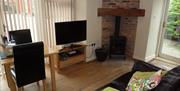 An image of a dining area at Littlemoor Barn, Cloughton -  Owners Cottage