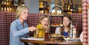 An image of a faming eating at Reighton Sands Holiday Park