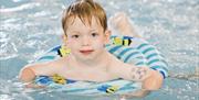An image of a child swimming at Flower of May Holiday Park