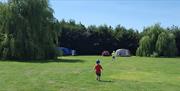 An image of a child running around Jasmine Park