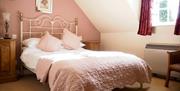 An image of a bedroom at Wrangham House Hotel
