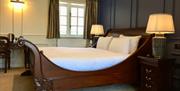 An image of a sleigh bed at Wrea Head Hall Hotel, Scarborough
