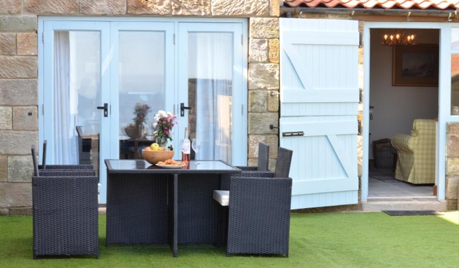 An image of an outside seating area at Boulby Grange Cottages