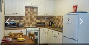 An image of Orchard Farm Holiday Village Cottage Orchid inside kitchen