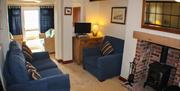 An image of living room at  East Cliff Cottages